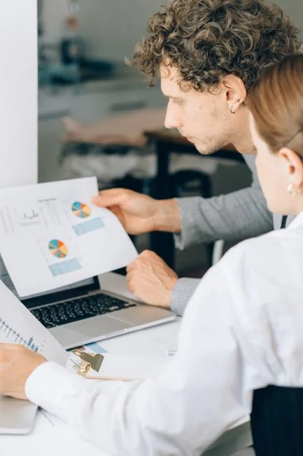 Person analyzing cryptocurrency data using a laptop, highlighting financial insights.
